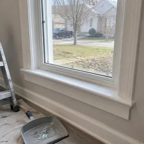 New glass pane in a white window frame with trim